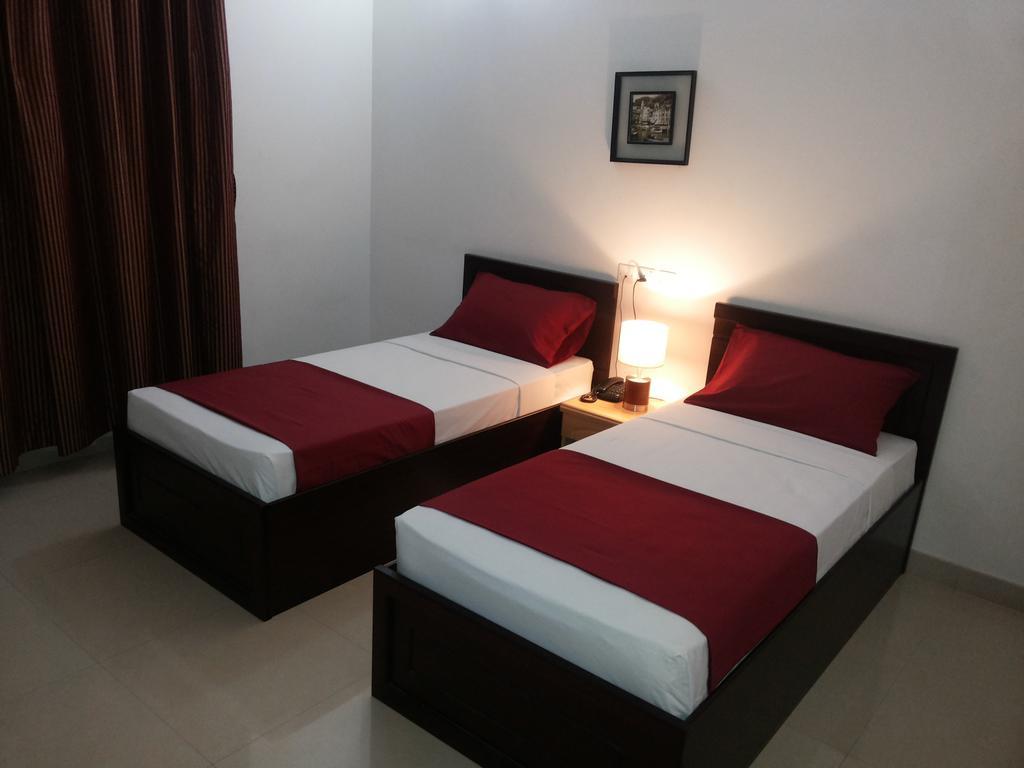 Azaiba Hotel Apartments Mascate Quarto foto